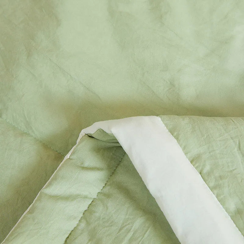 Antibacterial raw cotton washable summer cool quilt in Haze Blue colour, showing quilted pattern and fabric texture