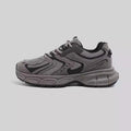 Low-top Dad style casual sneaker with round toe, leather stitching, and front lace-up closure on EVA platform sole