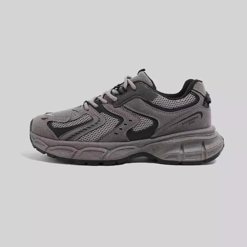 Low-top Dad style casual sneaker with round toe, leather stitching, and front lace-up closure on EVA platform sole