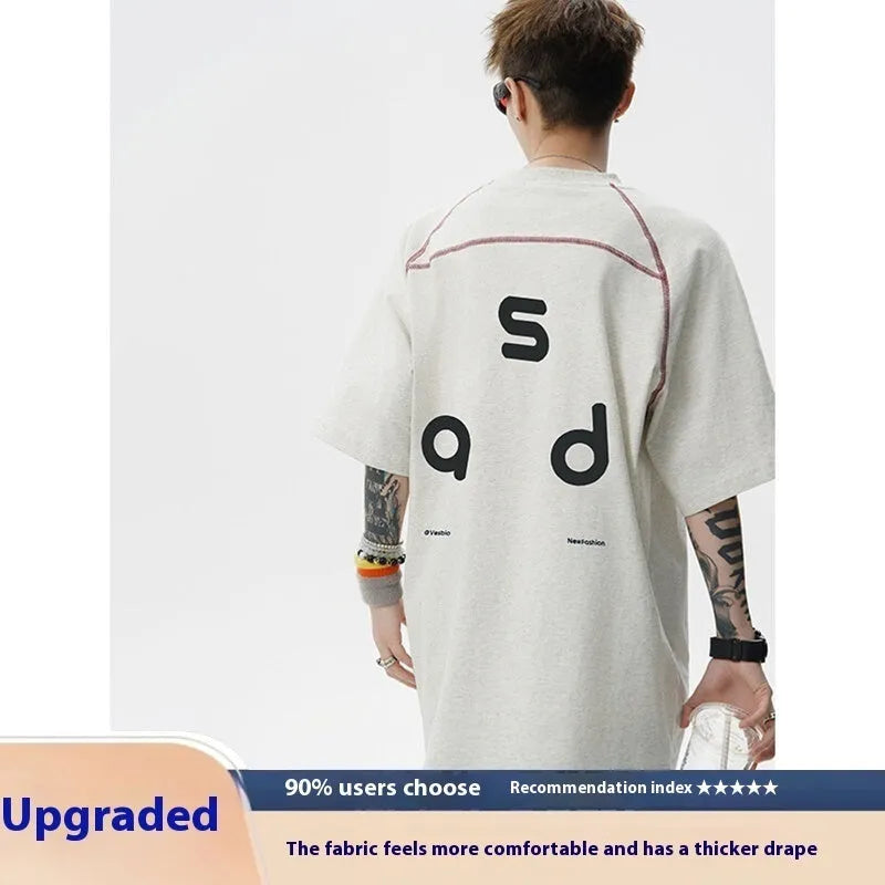 Men's loose fit cotton T-shirt with letter print design in black colour showing short sleeves and round neck