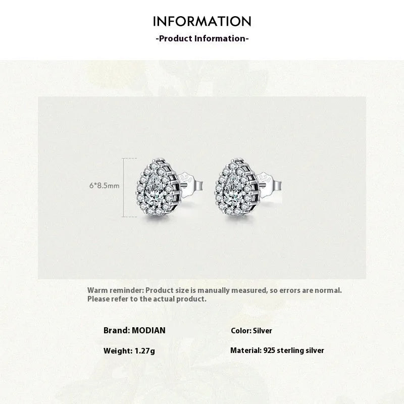 A pair of women's sterling silver water drop shaped stud earrings with a diamond-cut finish.