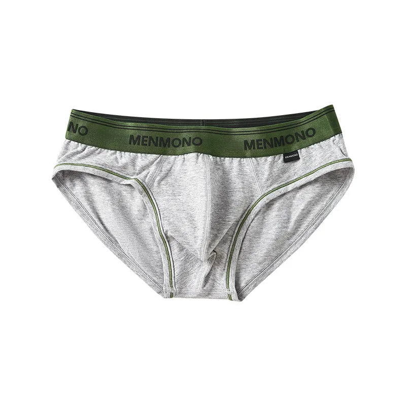 Men's low waist cotton briefs in a selection of solid colours including black and blue, white and red.