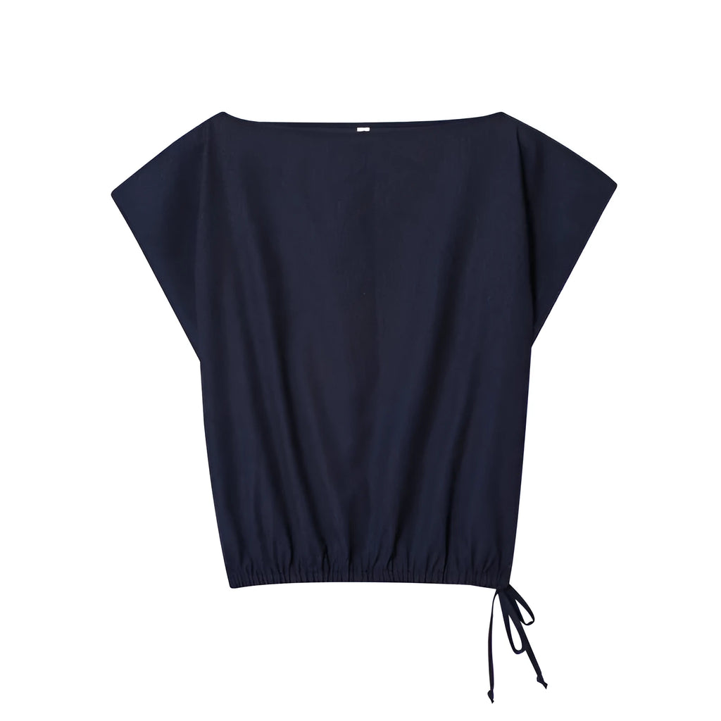 Women's linen blend co-ord suit with flounced sleeve top and wide leg trousers.