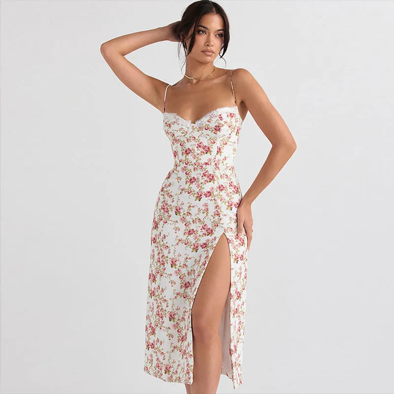 Women's long summer dress with lace flower print, suspender straps, and a high-leg slit.