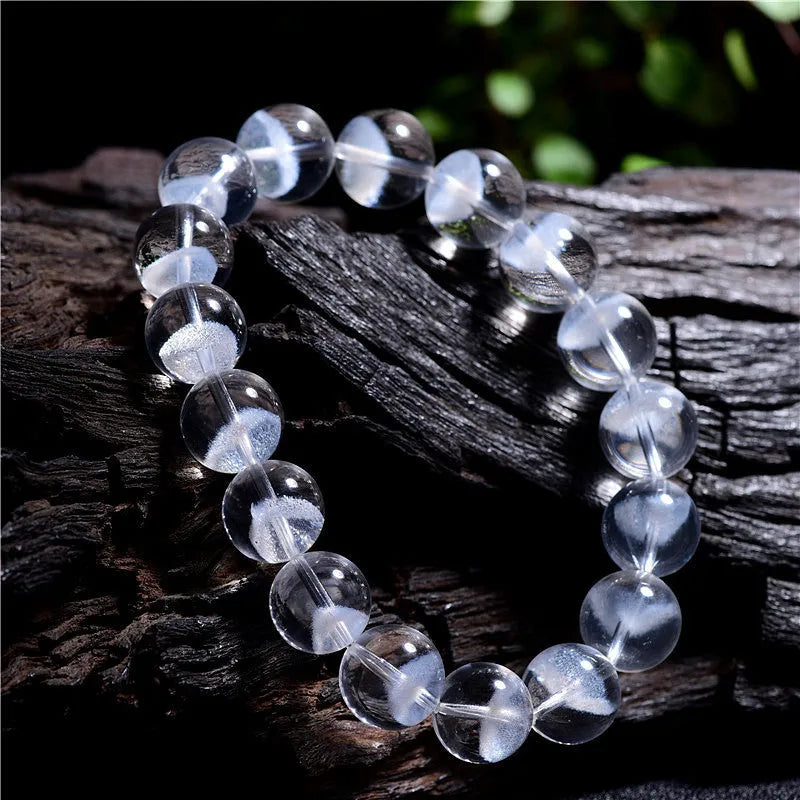 Women's white crystal pyramid bracelet with traditional Ruyi element design showing multiple bead sizes