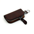 Genuine leather car key case in frost black and brown, showing soft cowhide material and size.