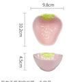 Cute strawberry design porcelain dinnerware set with flower bowls, straw hat plates, and a twist spoon.