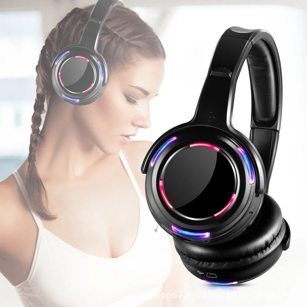 Black silent disco wireless headphones with a head-mounted design and a 3.5mm connection cable.
