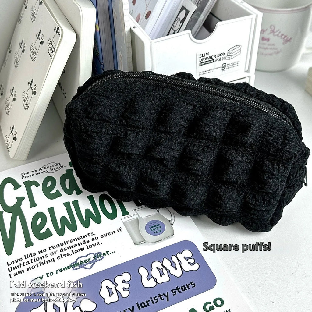 Fabric pencil case with cream puff personality design in beige and black colour options