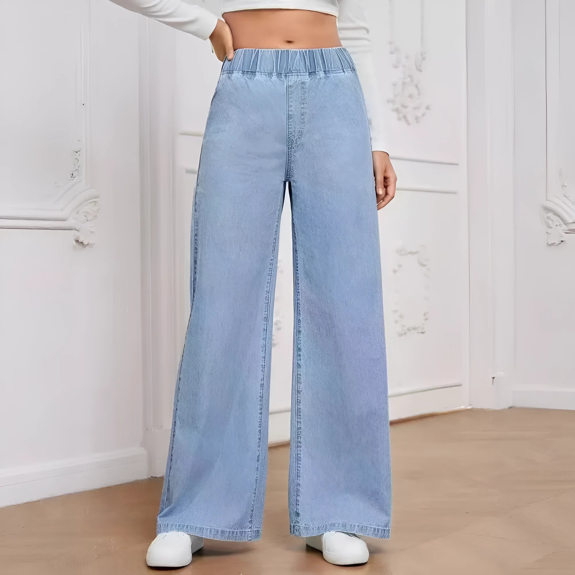 Light blue washed wide-leg denim trousers for plus size women with straight fit and mid-rise waist