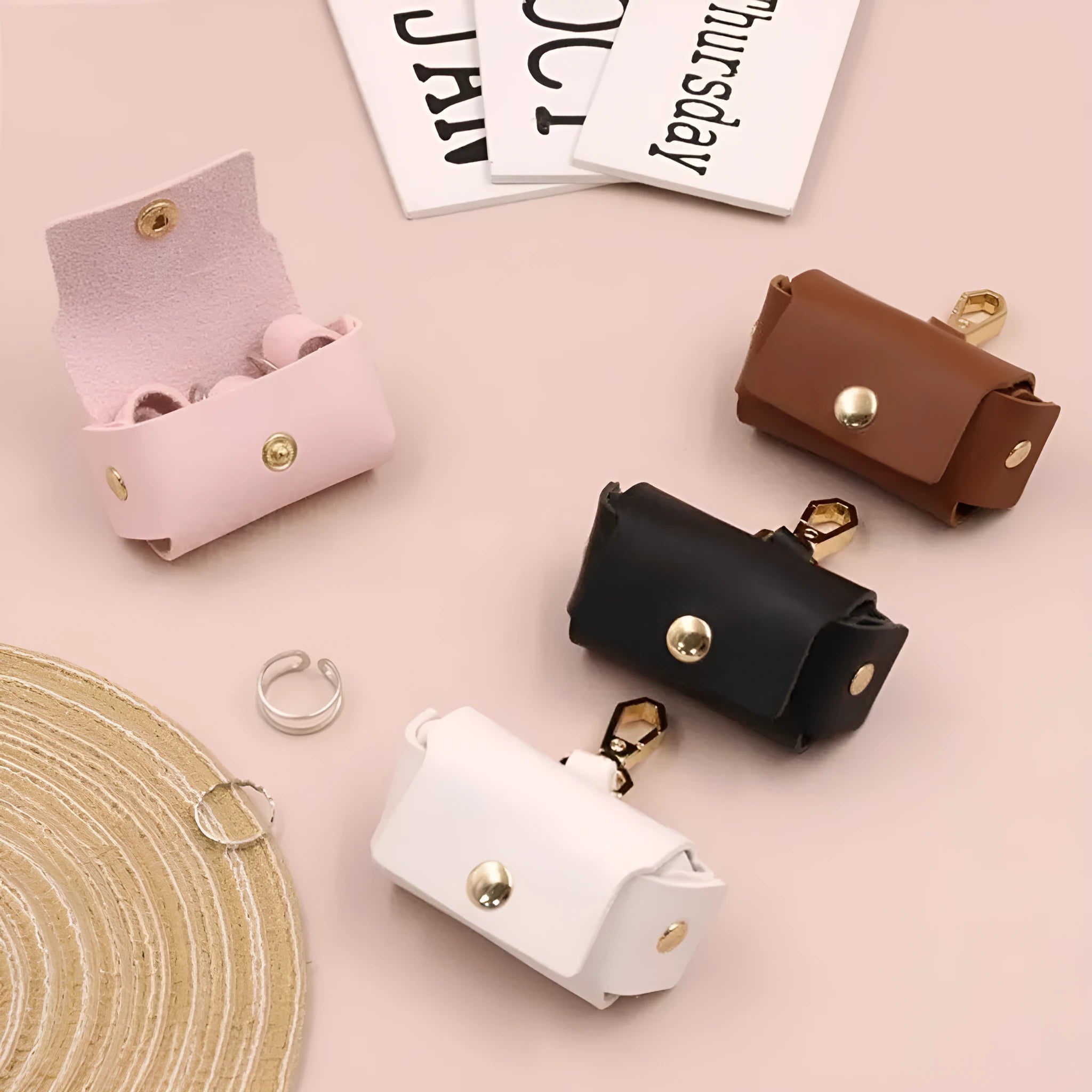 Solid colour hard leather ring storage bag in Korean style, 57x25x35mm, holding a ring