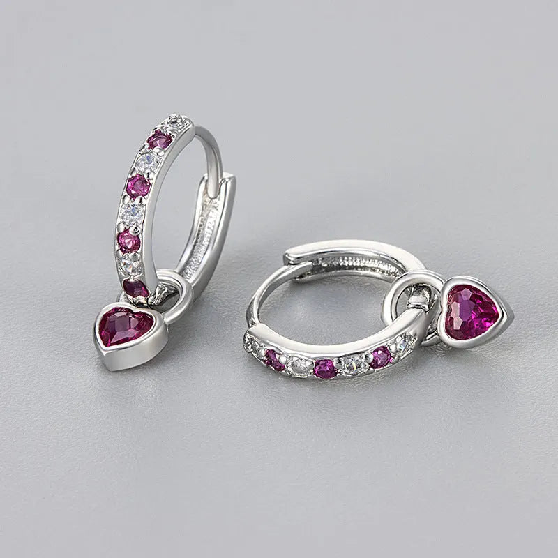 Women's copper earrings with heart-shaped drops and coloured stone accents in gold or white gold tone settings