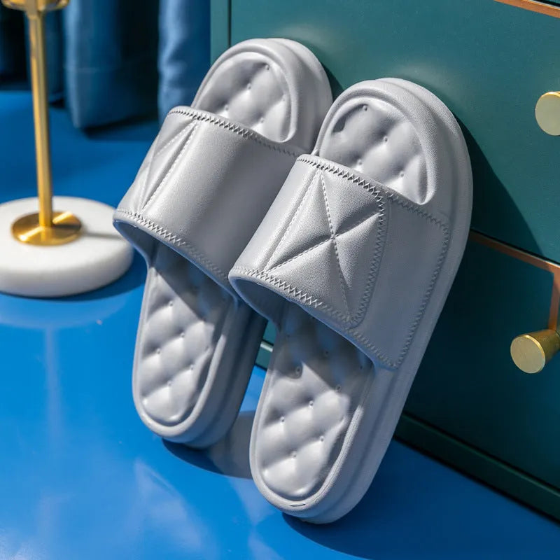 A pair of soft EVA bathroom slippers with a thick non-slip sole, shown in a choice of colours.