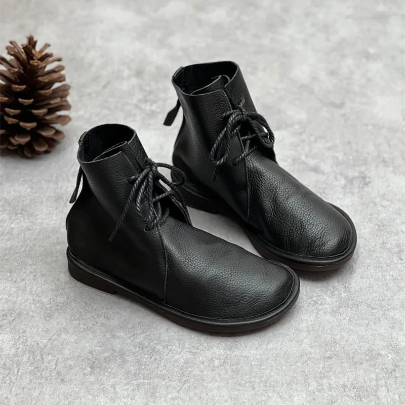 Retro genuine leather Martin boots for women in black, flat heel, round toe, front tie strap.