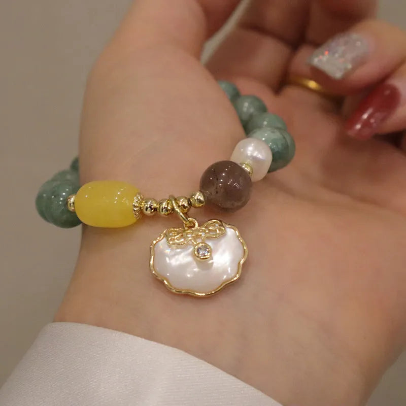 Women's casual bracelet with a single green jade bead on an adjustable band.