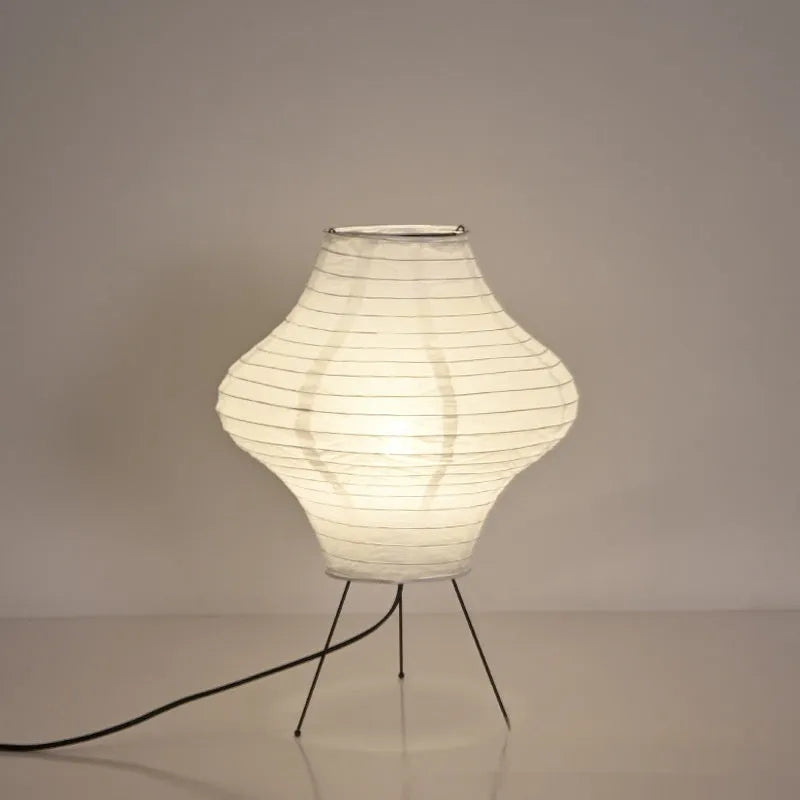 Japanese-style Xuan paper table lamp with a white shade on a wooden base.
