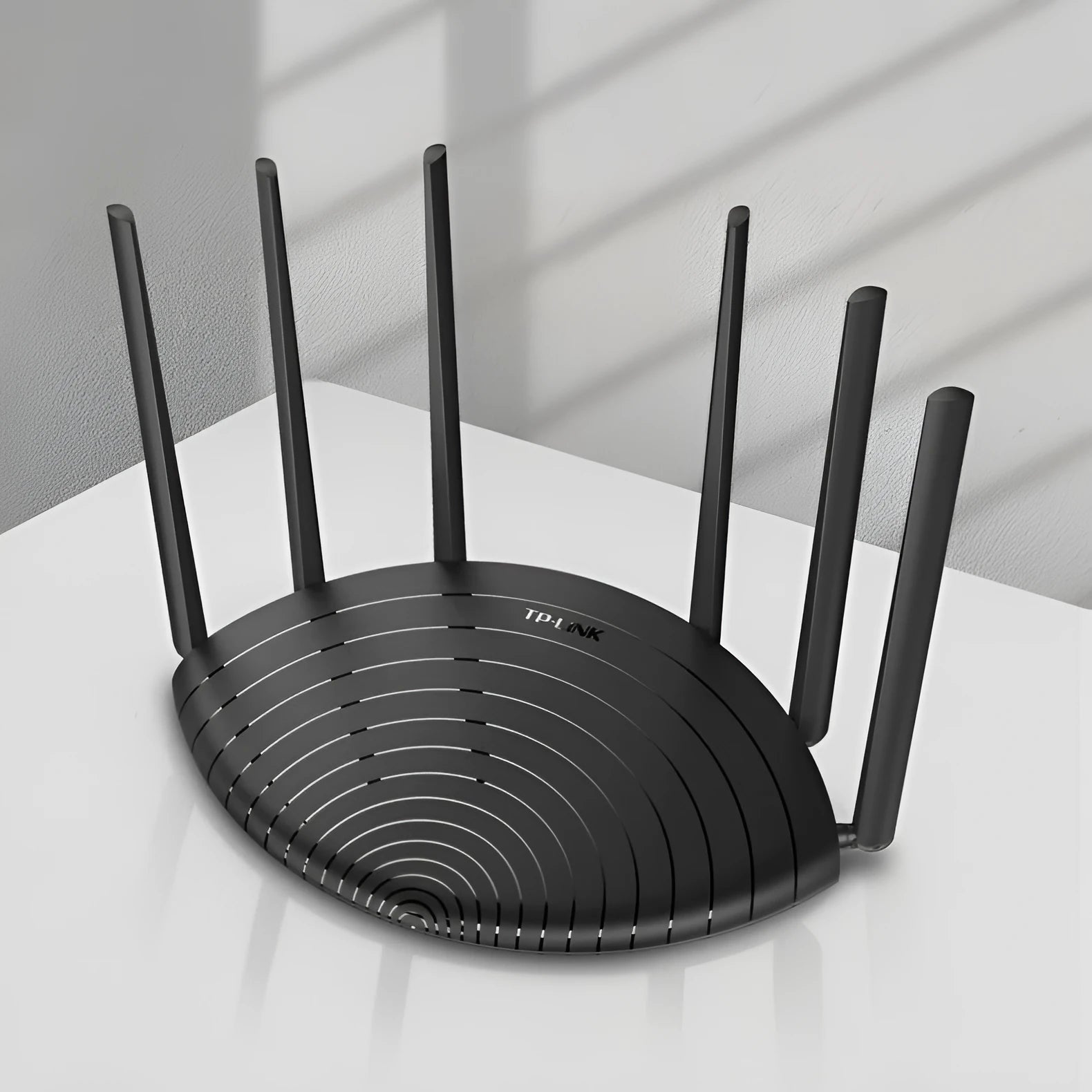 TL-WDR7661 AC1900 Gigabit wireless home router with compact black chassis.