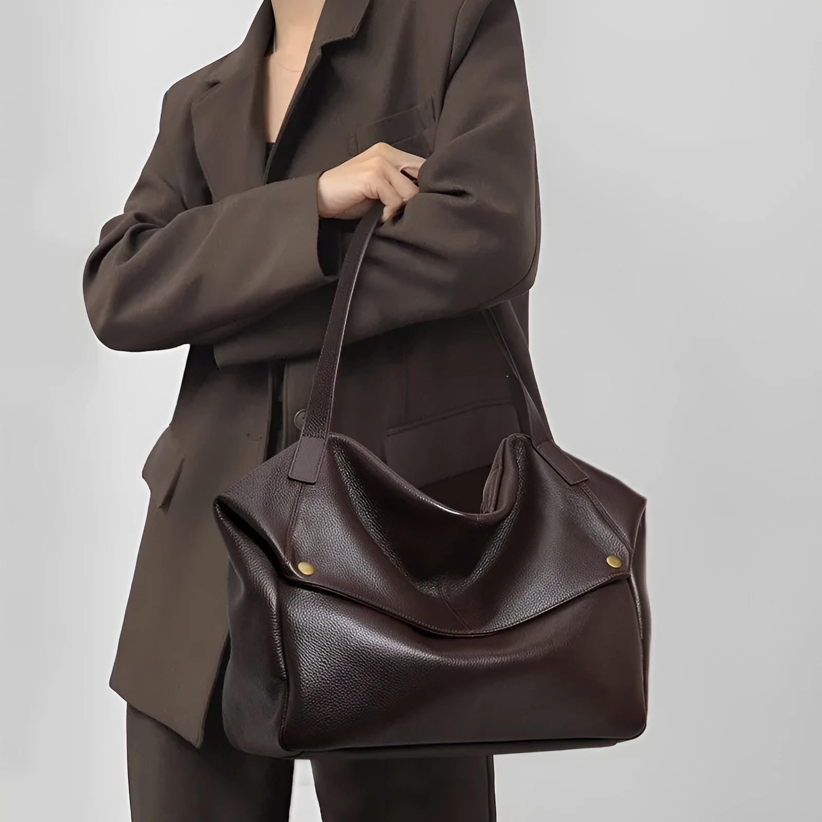 Brown genuine leather women's commuter shoulder bag with horizontal square shape and shoulder strap