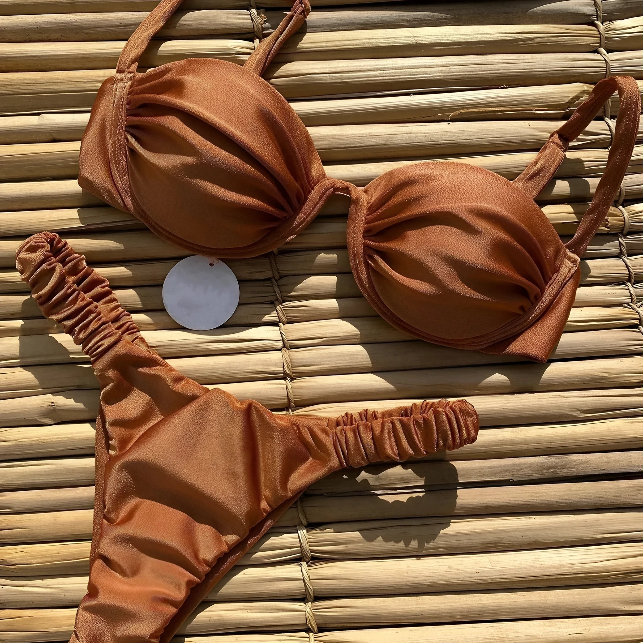 Women's black underwire bikini swimsuit on a mannequin, showing brief style and supportive fit.
