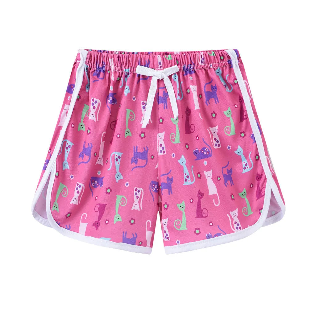 Children's polyester beach shorts in various colours and patterns including stripes, prints and solid options