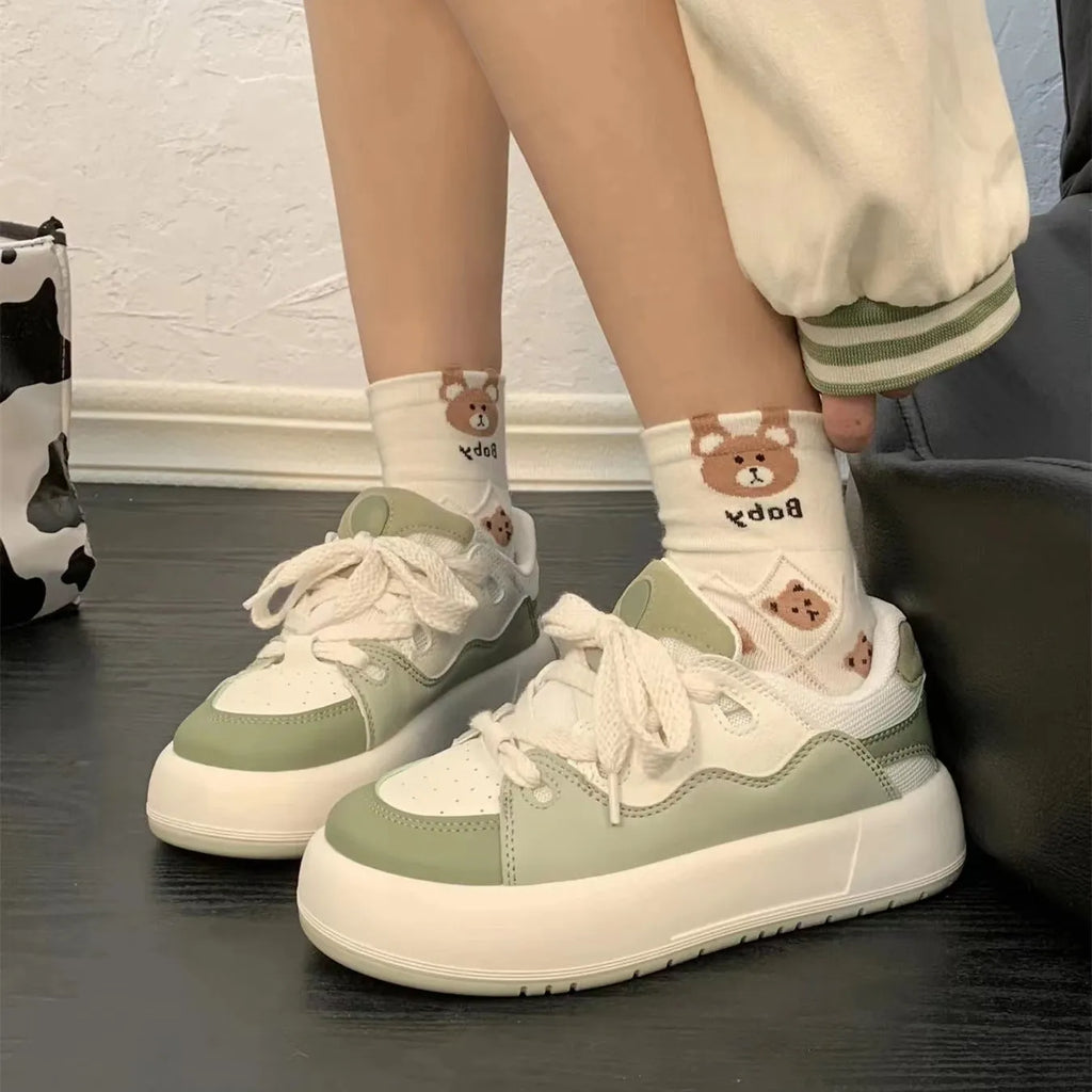 Green women's casual shoes with round toe and flat heel, made from breathable PU mesh.