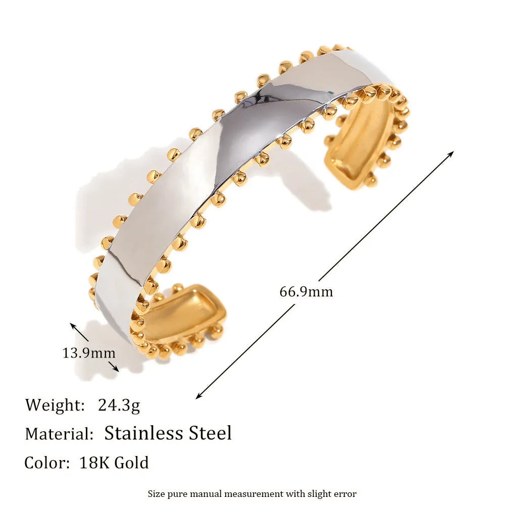 Women's geometric gold stainless steel jewellery set showing earrings, bracelet and necklace