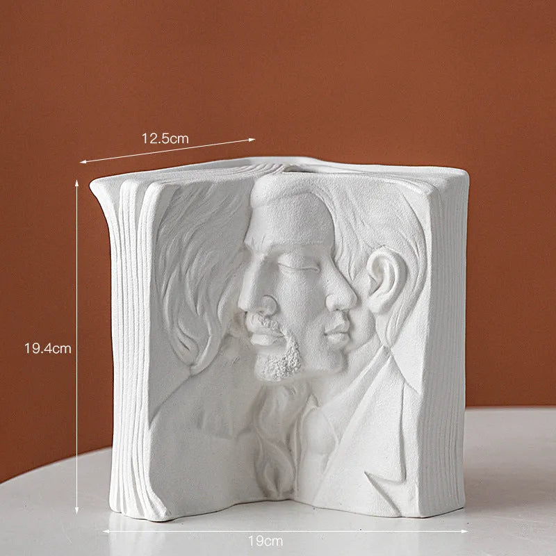 Ceramic book stand with glazed finish in one of four artistic designs on a desk.