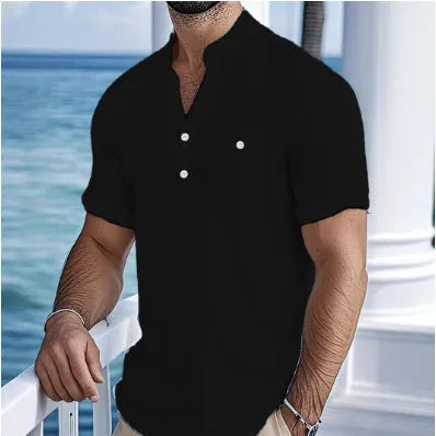 Man wearing a light blue linen-blend stand collar T-shirt with short sleeves and a loose fit.