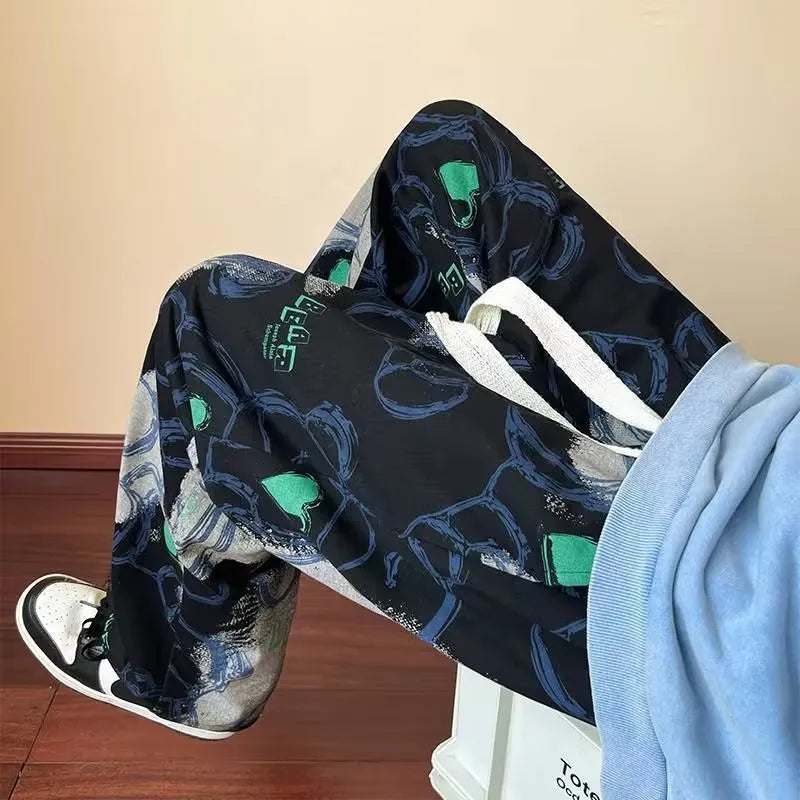 Men's casual polyester fibre trousers with cartoon print in black, size M to XXXL