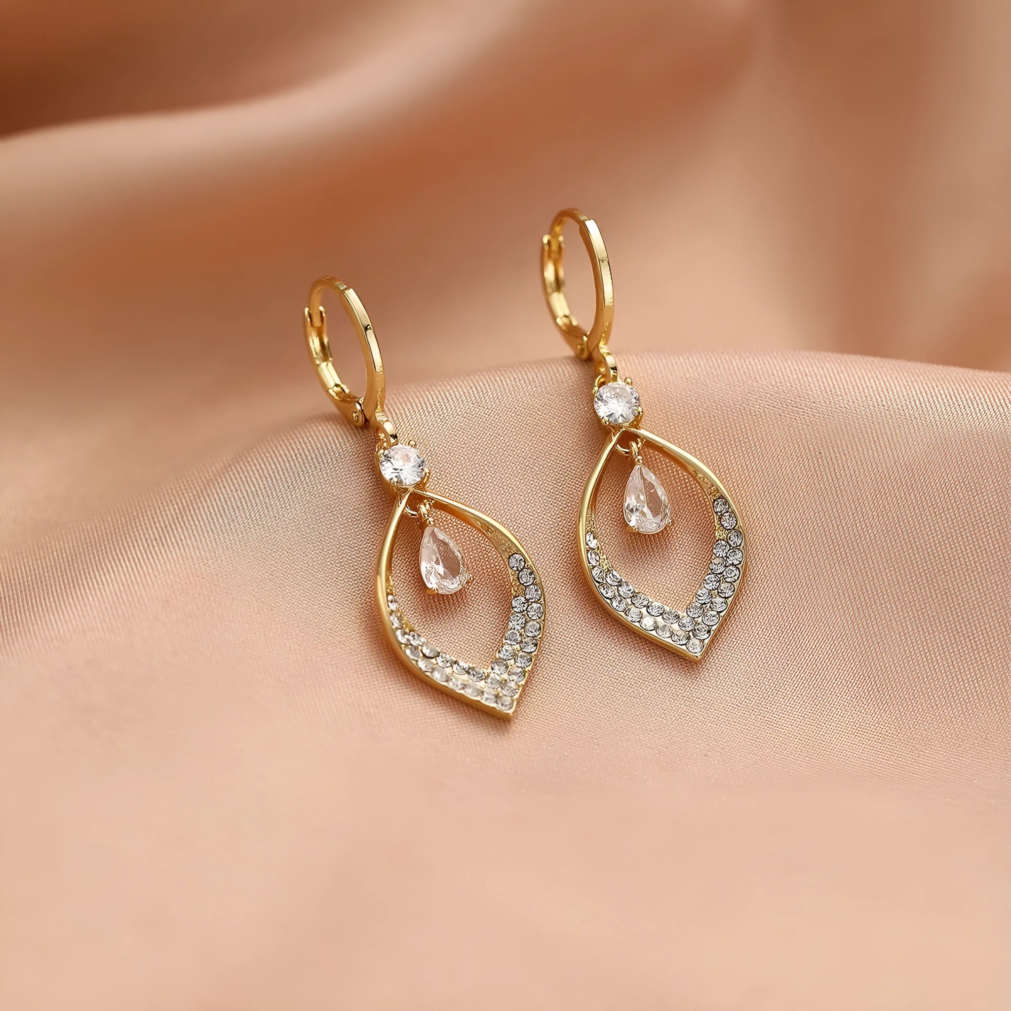 Copper electroplated women's earrings with water drop tassel design and gold or silver buckles