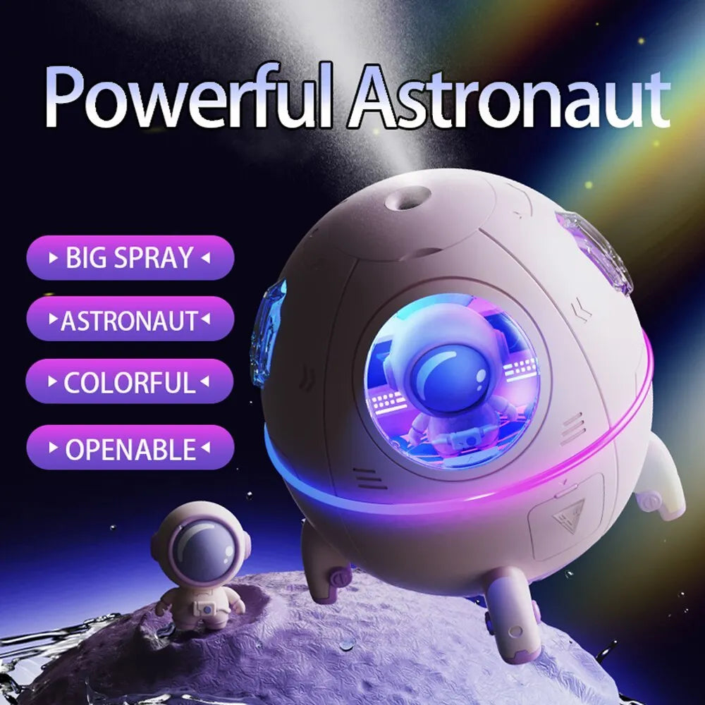 Purple astronaut-shaped USB desktop humidifier with LED light on wooden desk