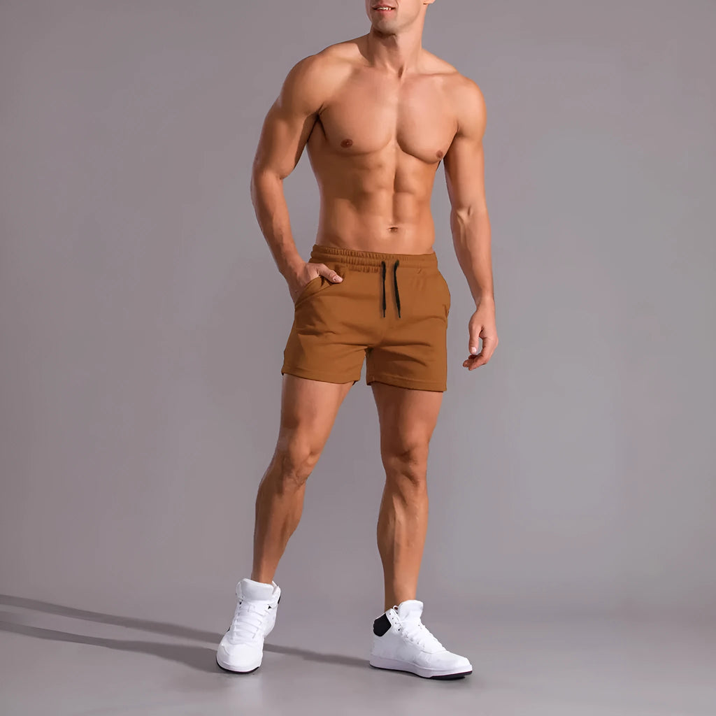 Set of three men's solid colour casual shorts with drawstring waists in black, khaki and light brown