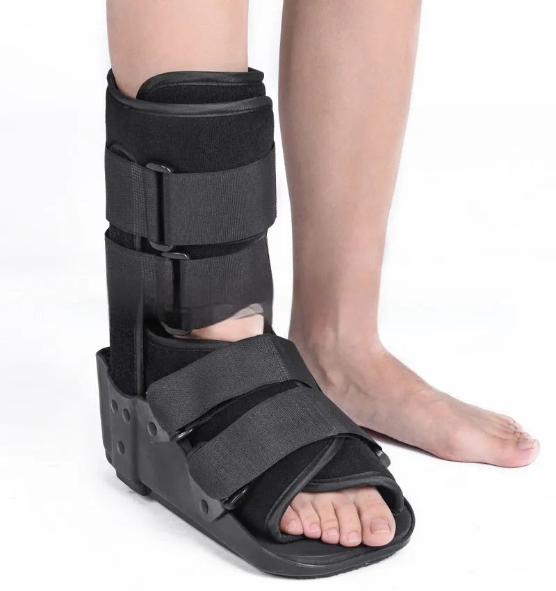 Grey Achilles tendon rehabilitation boot with aluminium struts and adjustable straps.