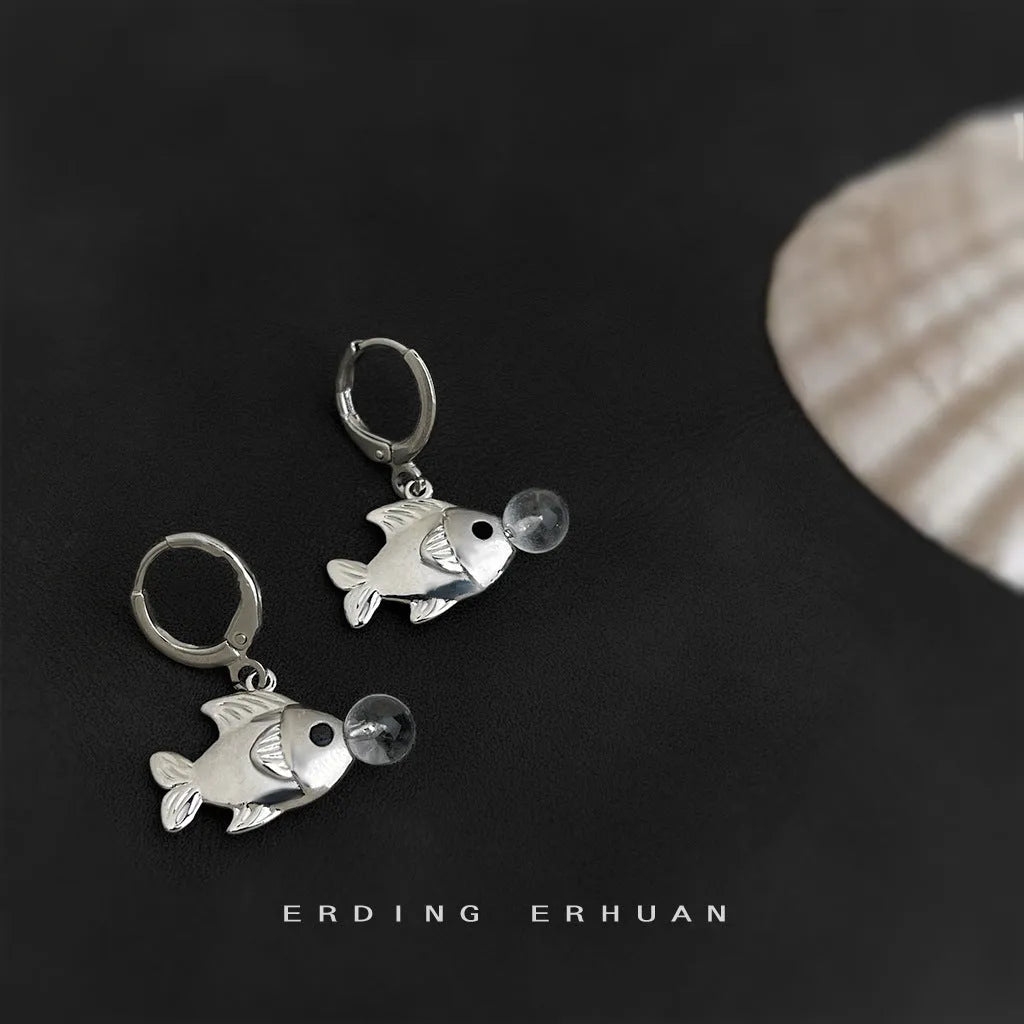 A pair of copper fish earrings with an electroplated goldfish bubble design.