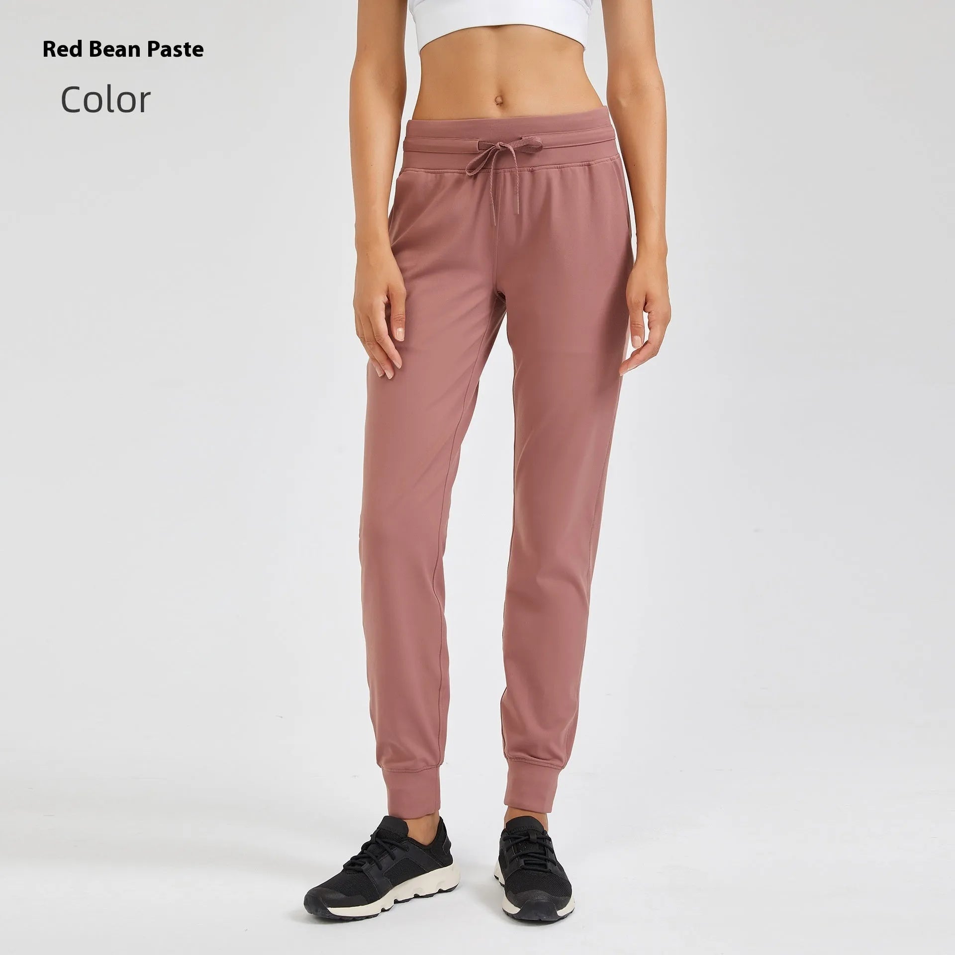 Women's high-waist yoga pants with drawstring waistband in distilled coffee colour, suitable for fitness.