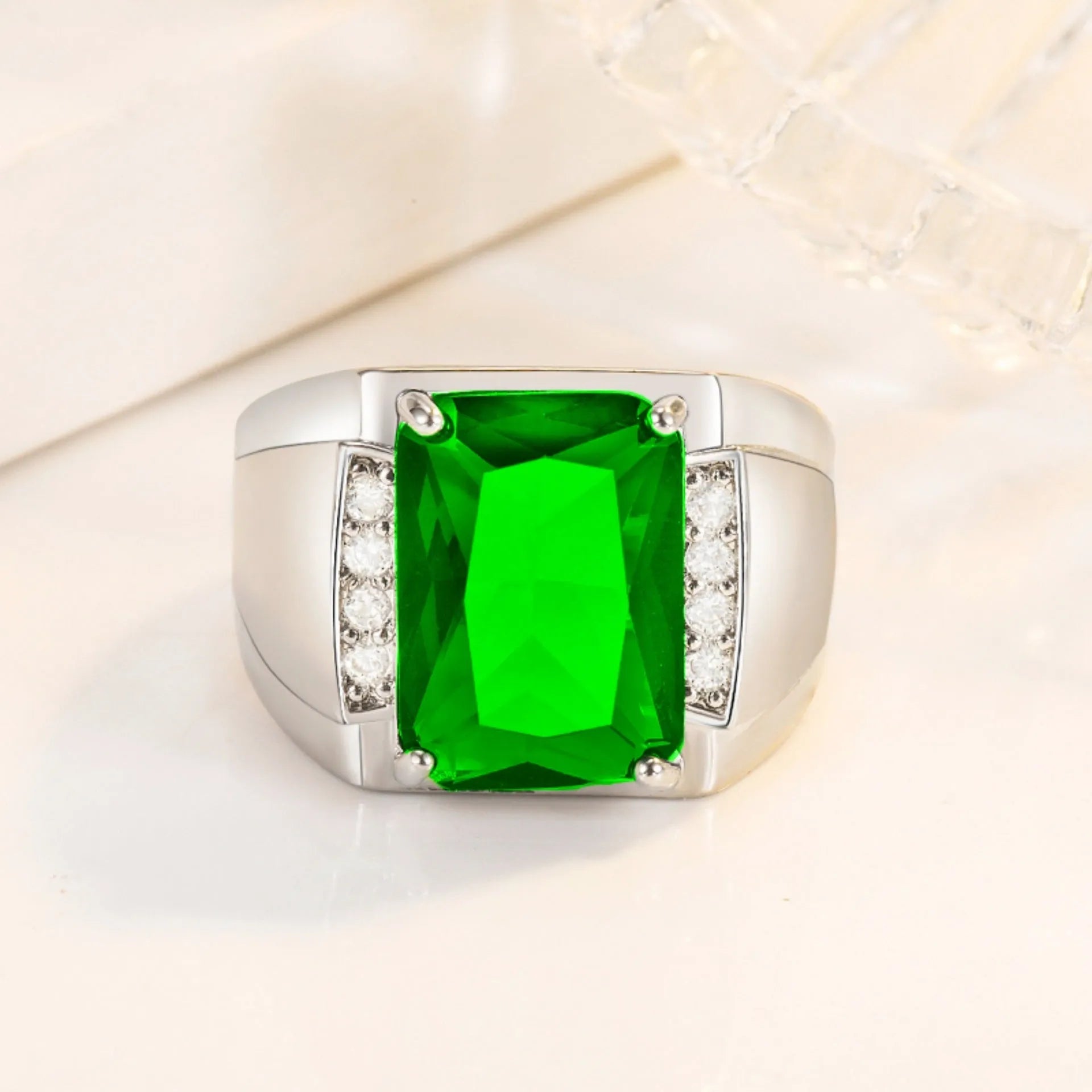 Adjustable open geometric ring with a coloured rhinestone on a copper band.