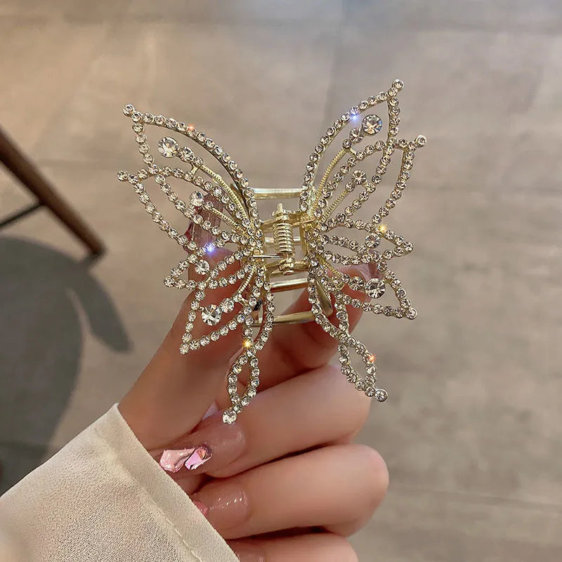 Butterfly-shaped alloy hair clip for women, shown in rhinestone and pearl style options