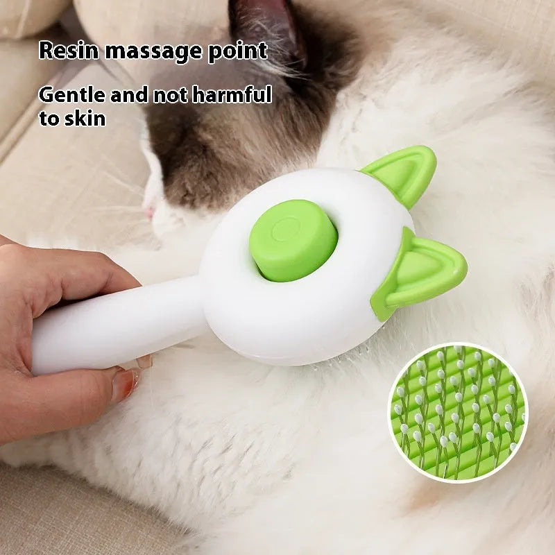 Greenish white cat grooming brush with stainless steel self-cleaning teeth and TPR massage tips