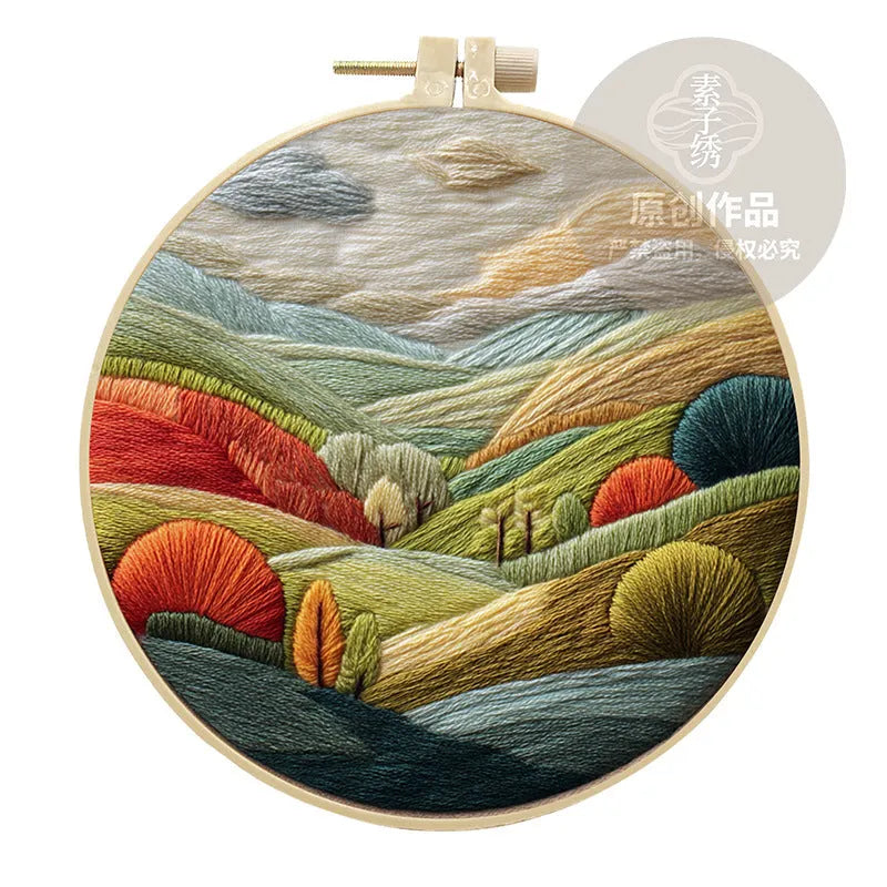 Embroidery DIY kit with printed landscape fabric, embroidery threads, needles, and frame for handmade cloth art