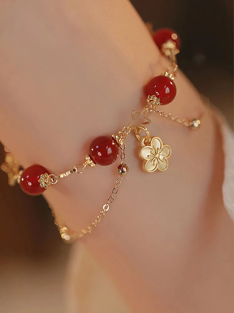 Handmade double layer red agate bracelet with peach blossom and flower design for women.