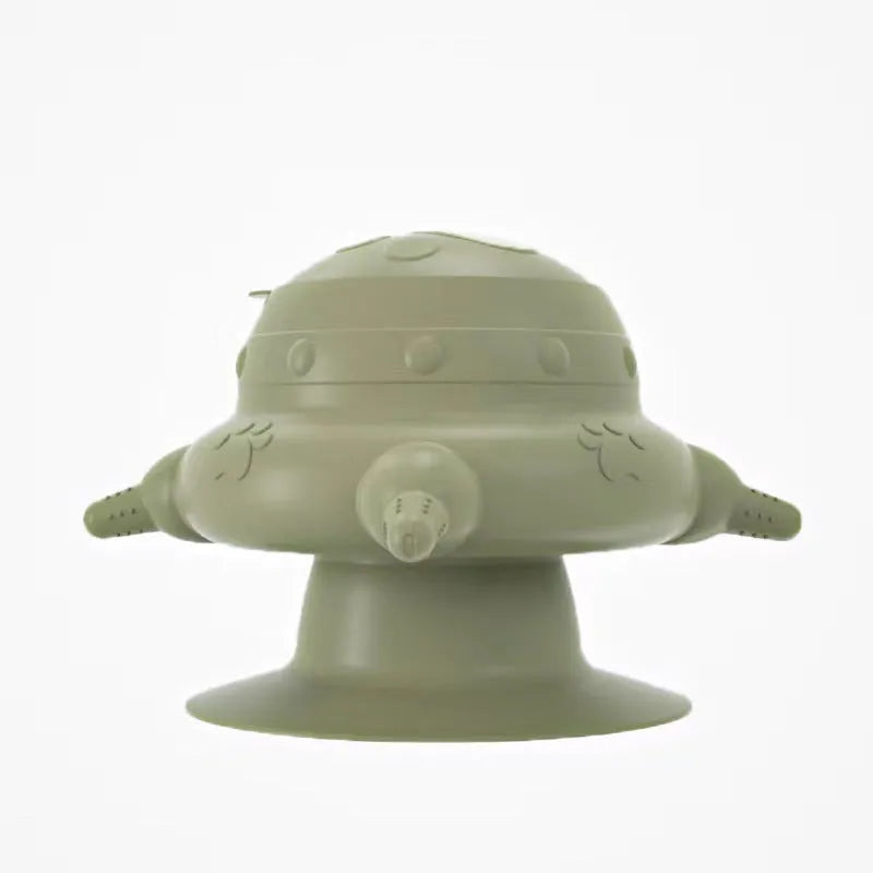 Pink silicone pet milk feeder with four nursing pacifiers and a lid on a flat base.