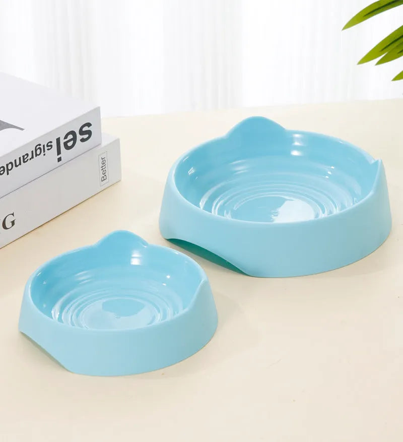 Blue ceramic dog slow feeder bowl with raised maze pattern inside for slowing down fast eaters.