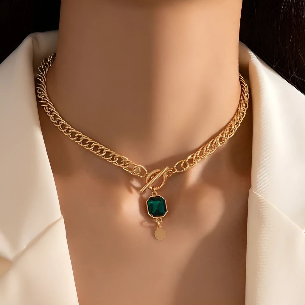 Gold electroplated titanium steel necklace with geometric round pendant on Cuban link chain
