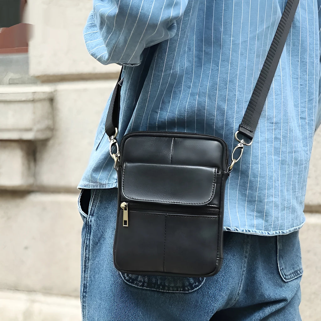 Men's brown leather crossbody shoulder bag with visible sewing lines and polyester cotton lining