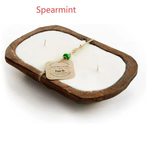 Retro-style lavender aromatherapy candle in a wooden basin made from soy wax.