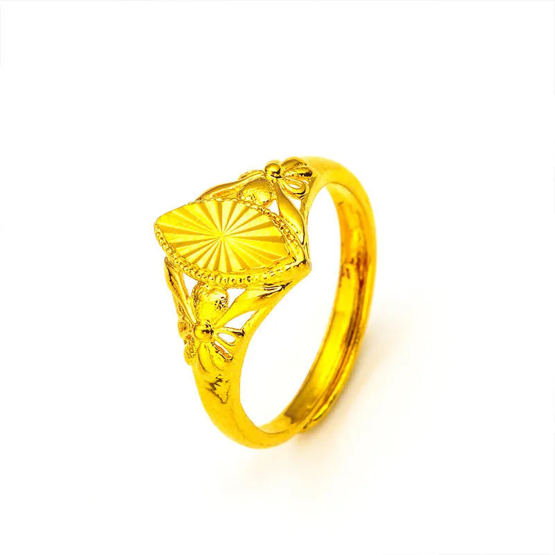 Alluvial gold tone open diamond flower ring with geometric design and textured surface