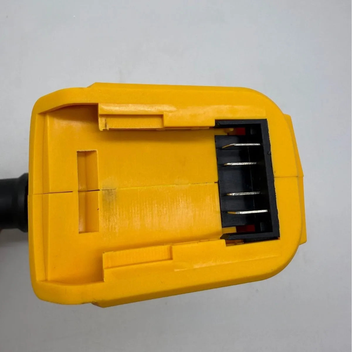 Handheld cordless lithium battery air exhauster with bare metal head for dust blowing and snow removal.