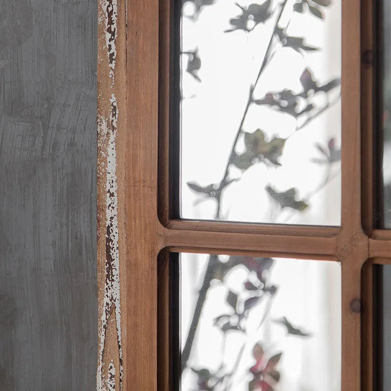 Terrace log colour wooden frame fake window wall mirror on a plain wall.