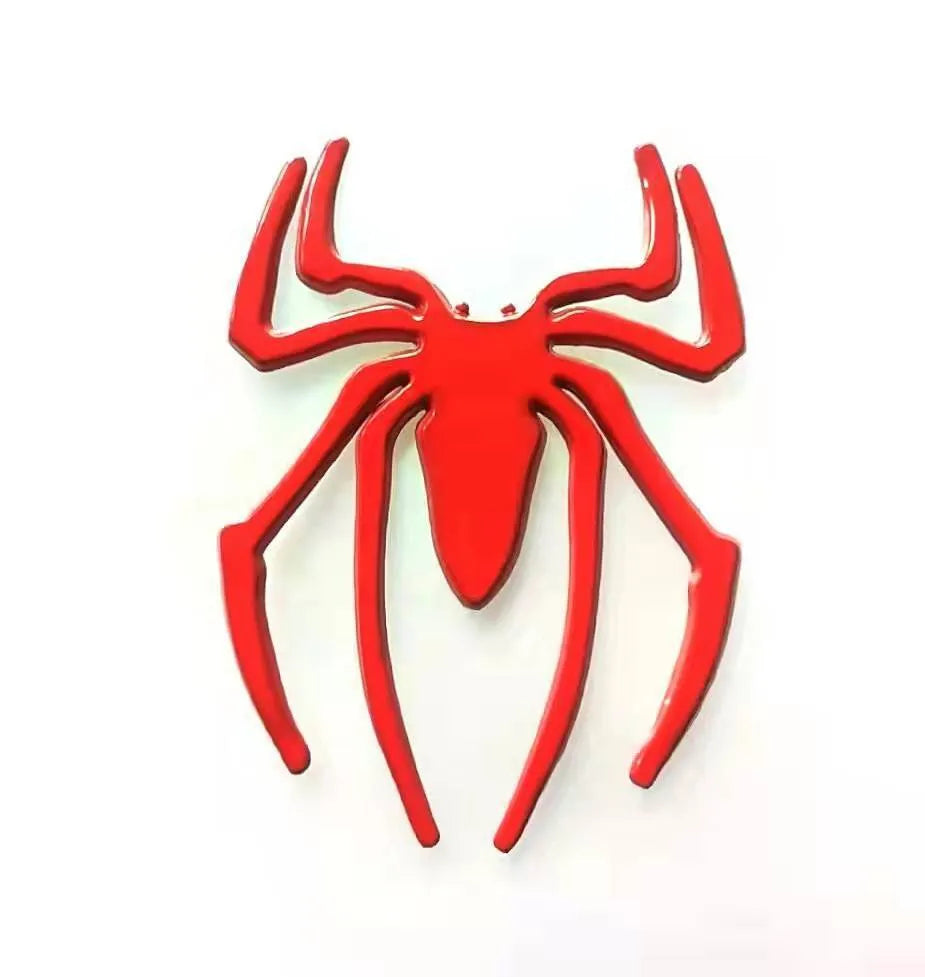 Three-dimensional metal spider sticker in gold colour, measuring 7cm by 5cm.