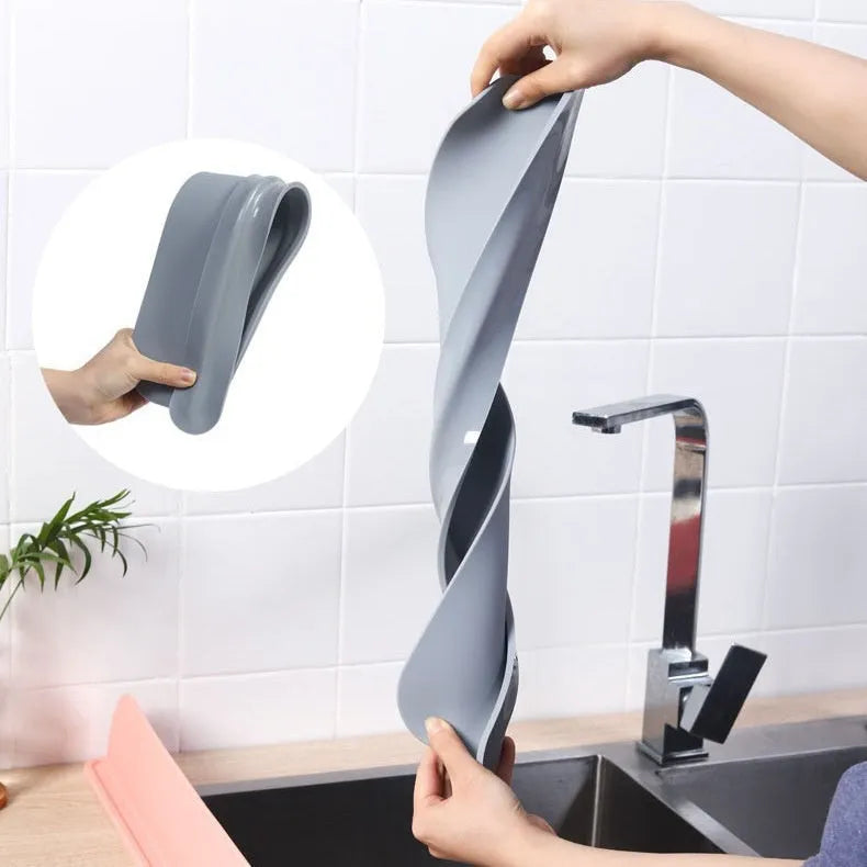 Grey silicone kitchen sink water blocking plate measuring 52mm wide x 85mm high